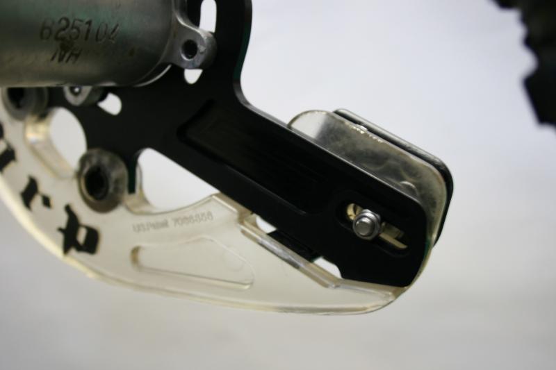 Poly skid plate. Notice the 3 attachment points