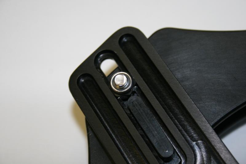 Backside of upper boomerang with relief channels and slot