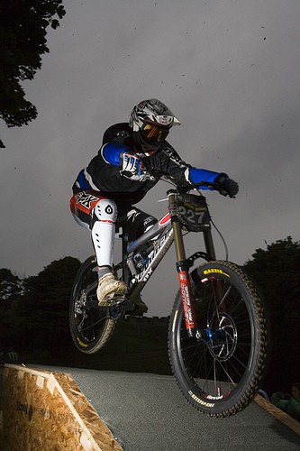 Night time and mirrored lenses? It was dark, wet, cold, windy.  Or did this help you stop being blinded by the million flashes from the huge crowds? Maybe he was right. Tip to epileptic riders don't race night races!