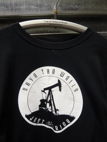Save the Wells shirt hanging on a velo sport hanger