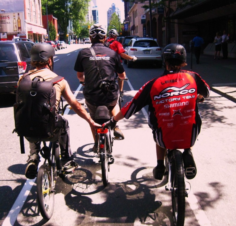 Derek and Ryan getting towed uphill by Dustan on the Slipstream