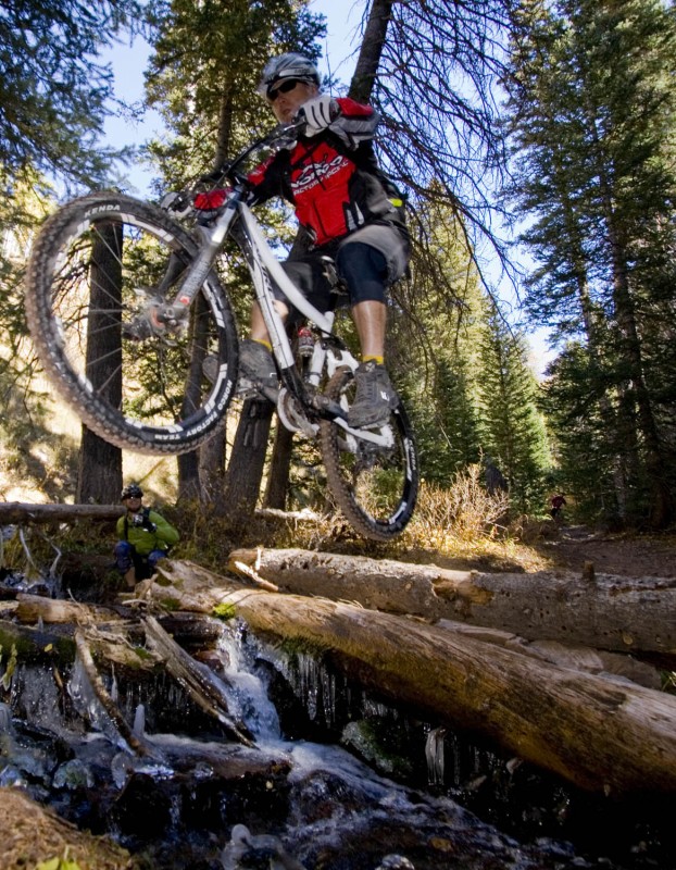 Pete jumping a creek on the descent.
