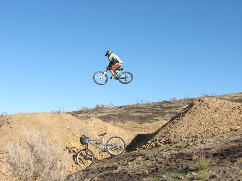 Jim Mongomery hucking it over the canyon gap on the Stormin Mormon trail.