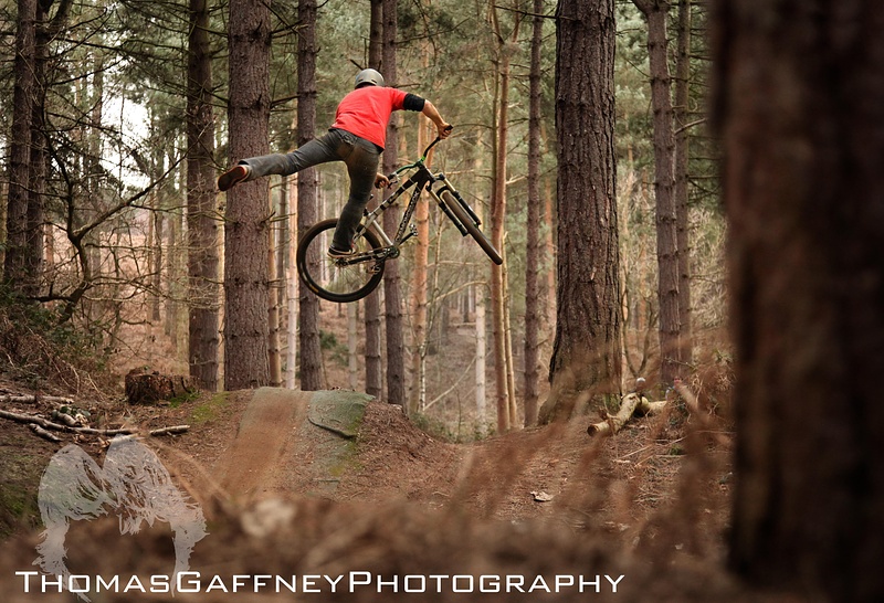 Blake tail whipping into the step down on the freeride section at chicky