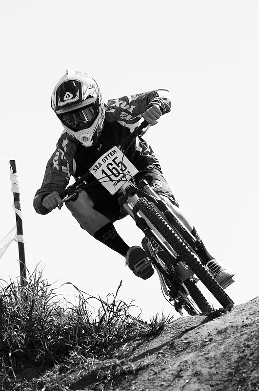 Chris Boice rounding the first turn. A nice dropping right-hander to right-hand berm.  <br> If you didn't suck it up, you just went over and missed the berm and rode right into me.  <br> Thankfully only one dude did that.