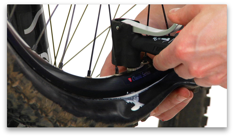 3:08 mark - Add air. Certain tire and rim combos may inflate quickly with only a pump, while others may require soapy water or a compressor to get them to seal