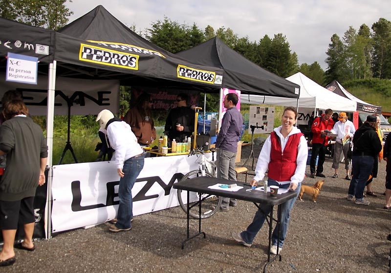 Super-volunteer Christie in front of the Lezyne tent taking care of registration 