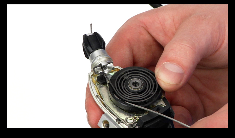 Step 6. Now it's time to install your new cable. Thread it in using the same path as the old cable. If you are having trouble lining up the cable to feed it though, you can use pointy spoke or even the end of a pen to help guide it through. Be sure that the cable end is fully seated in its home position