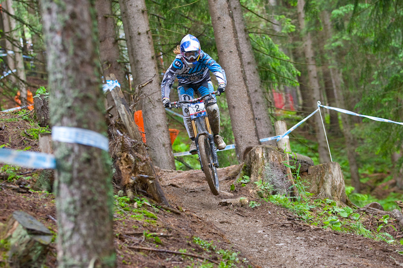 Rachel Atherton gets airborne in one of the mid course technical woods sections. The mud below this was a good 6