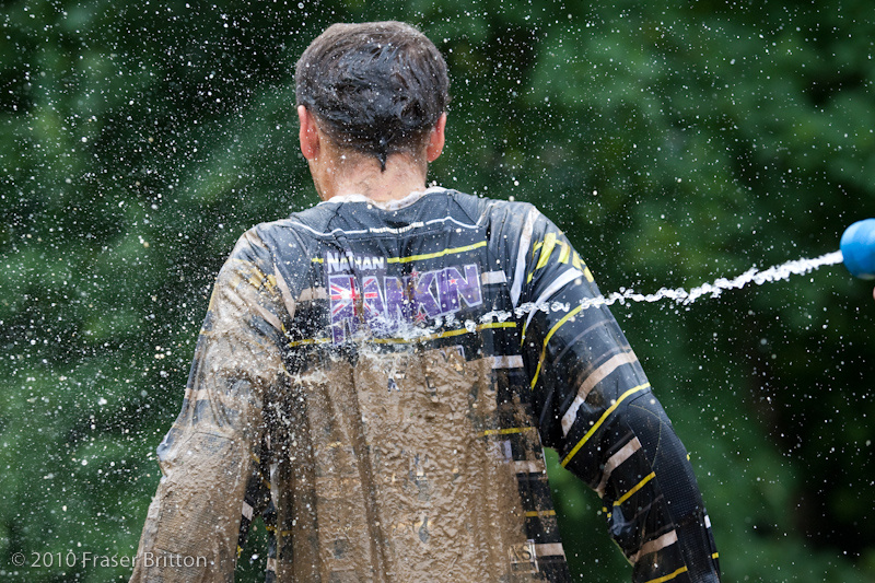Nathan Rankin gets the mud hosed off of him by his mechanic. And yes, it is as cold as it looks.