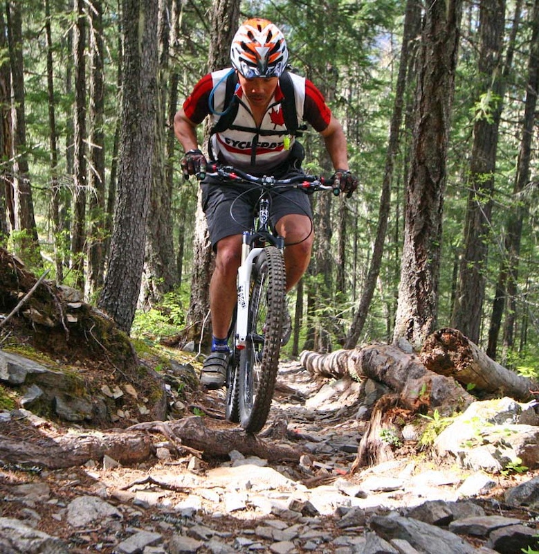 Climbing rocky roots in Lumpy's Epic - Pemberton, BC