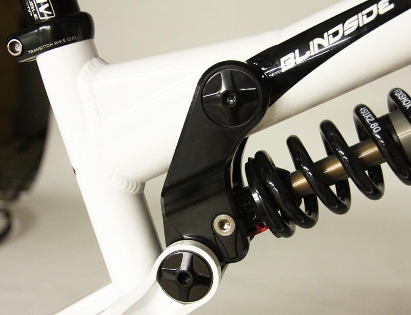The allen bolted chip on the rear shock lets you adjust travel from 6.5 to 7.5