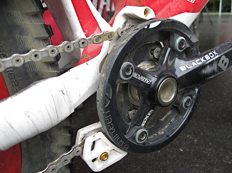 Hidden behind the modified guard is a 31 tooth ring that works with Brendan's 9 - 21 cassette (the 21 is locked out) to provide the appropriate gearing while having more clearance and still being able to hit 88 mph during race runs. There were many comments on the 1 x 6 story we ran last week that it must surely be a typo that the Specialized team bikes use 30 and 31 tooth rings with a standard 4 bolt 104 mm bcd crank - it wasn't a typo and they do run 30 and 31 tooth rings. But how?