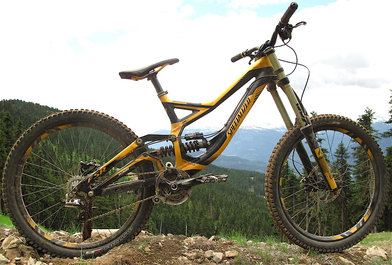 You're looking at the 2011 Specialized Demo 8 One. The black and yellow machine is one level down on the price scale from the deluxe red and white model, but still uses a smart spec like the Boxxer Race fork and SRAM drivetrain. Both models use the same frame, which is also the exact one that the Monster Energy Specialized team rides into battle on the World Cup circuit.
