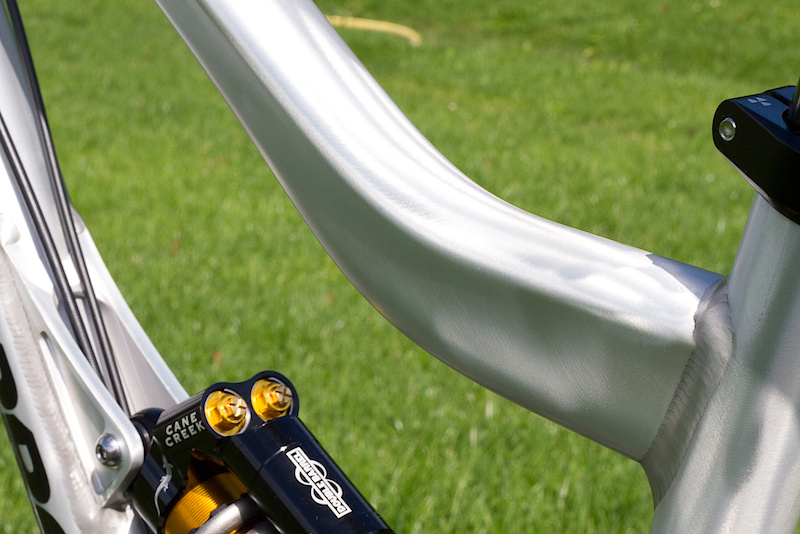 Shapely top tube detail on the Scalp. There will be two color options to pick from, this catching raw version, and a brighter yellow option for those who don't want to be missed. I'm a huge fan of raw bikes, having removed the paint from many of my own rides over the years, and am stoked to see more companies offering this from the factory. No matter how rough you treat her or how many times she falls out of the back of the truck, a paintless finish will always look dialed down the road. Plus you look like a factory rider!