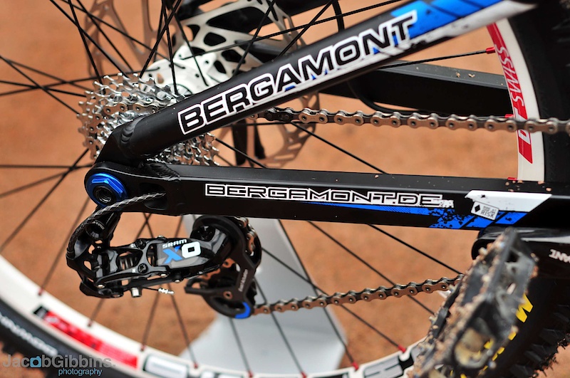 New for 2011 is this Co-Ax pivot. It aims, like others using a similar design, to keep the suspension active under braking by separating out the suspension and braking forces. This photo shows a bolt through axle, but production bikes will come with custom made Maxles to cope with the width of the dropouts. Notice the rear derailleur cable which is routed through the chainstay to keep it out of harms way.