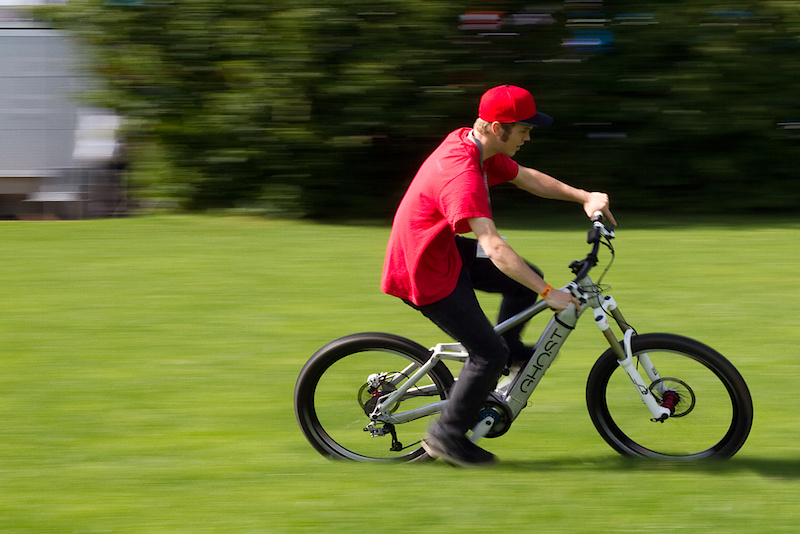 Jordan out from behind the lens and having a go on the E-Ndure. No, a quick spin in a grassy field is by no means a test, but after some circles on the bike we could both see the potential for good times out on the trails. The important thing to keep in mind about the E-Ndure is that it is built to be a truly capable bike. Take it out to your local bike park and send it off whatever booters and drops that you'd usually hit, or ride it fast down the hardest DH tracks that you can find - it is designed to handle it. Where the bike's true powers will shine are locations that don't let you take an uplift to the top of the trail. I'm of the opinion that one should certainly earn their turns quite often, but acknowledge that a lot of riders are strictly shuttle rats when it comes to shredding, this could be their ticket to fun without having to load up a truck or head off to the local ski resort. Keep in mind that you do still have to pedal the E-Ndure, the electric motor works as only an assist, so don't expect to be scooting up the steepest of hills with zero effort. Are electric assist mountain bikes the future? While I'm not going to go that far, I can definitely see them being an option soon, especially if they are going to look as dialed as the E-Ndure.