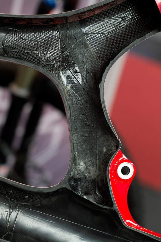 The new carbon V10's seatmast looks very different from it's aluminum brother. Take note of the visually different types of carbon used in different areas of the frame and then push the play button to hear Josh explain it.