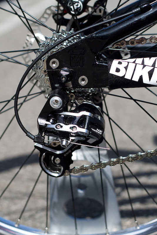 This is DMR's simple and effective 'Swopout' adaptable dropout system. Two bolts hold on each of the Bolt's aluminum dropouts and make for a simple job if you want to switch from a vertical geared setup to a horizontal single speed system. Availability should be around December or January with a projected retail price of $1300 - $1400 USD for the frame and rear shock.