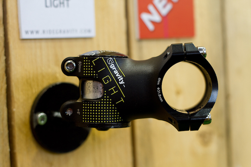 A lot of work goes into this small piece of hardware. The new refined Gravity Light stem is not only dressed up in new graphics for 2011, but also sees a major change in how it is made. The previous version was CNC'd which took quite a long time, but also used up too much material. The model pictured here is manufactured using a 3D forging technique - massive amounts of pressure are used to bring it to a nearly finished state, with it only needing to be cleaned up a bit and sent off to get colors done. The Gravity Light name makes sense here as the stem shown above weighs an impressive 145 grams, yet is still built to take whatever jump you have in mind. Three lengths are available, 90, 75, 60, and the 45 mm that is pictured. Oversize 31.8 mm bar clamp only. If you have a 1.5