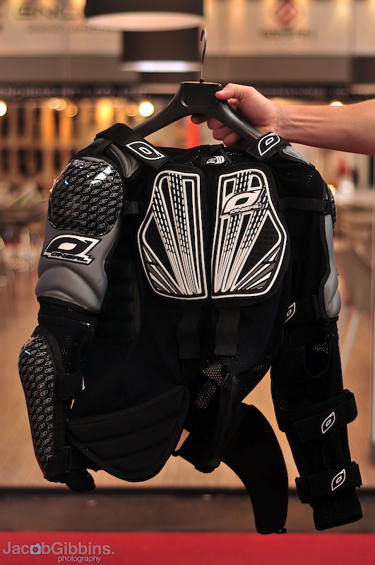 Looking for the whole kit and caboodle of protection in one go? Check out the Hellraiser Protector jacket shown above. This bad boy rolls all of the possible body armor combinations into one unit. One upside may be no longer showing up at the track to discover that you've forgot one arm pad at home, but also as anyone who has worn a full suit before will tell you, it eliminates that chance of pads moving around and not doing their job in a crash. The elbow and shoulder pads will always be where they're supposed to be, no matter how far you're rag dolling down the hill! Besides the arm and shoulder protection, the Hellraiser also incorporates back, chest, and even hip protection. Tying everything together is a mesh material that should keep you from overheating while hiking back up to have another go at that line that you ate it on. If you find that you want to pare it down even lighter, you can remove the back and forearm protection via zippers. While it certainly looks impressive from the outside, the best bits are hidden away from view, that being the same SaS-Tec memory foam that you find on the signature CG Sinner pads featured below. This neat stuff is soft and flexible until you find yourself crashing, upon which it instantly hardens up before the impact takes its toll. Pretty cool stuff, I'd say. Not a lot of racers seem to be wearing full upper body armor these days, partly due to not many options being compatible with neck braces. This isn't the case with the Hellraiser, it is designed to function with neck protection as well. Racers take note.