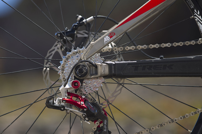 If you know Trek, you probably know ABP. If not, ABP is short for Active Braking Pivot and is exactly what it says. The chainstays and seatstays pivot directly in line with the rear axle which lessens the amount of rotation between the caliper and rotor, making for a more active system under braking. The less the distance changes between the caliper and the rotor as the suspension compresses, the more active the bike will be under braking. Simply put, it is a sort of built in floating brake. If you haven't spotted it yet, look at the rear wheel dropout in the photo above. You're also looking at the 88's rear pivot as well. ABP is used throughout Trek's full suspension line and has proved to be an excellent way of reducing braking effects on the suspension, something that is especially important on a World Cup caliber race bike like the 88.