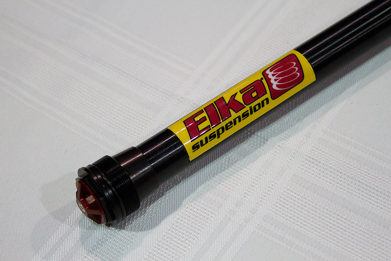 Here it is, the long awaited, much anticipated, and once top secret fork cartridge from Elka Suspension. Much like their rear shocks, Elka uses proven motocross technology to control the stroke, meaning a piston and shim setup, complete with a nitrogen charge and floating piston. Elka isn't trying to reinvent suspension here, and you won't find any plastic parts hidden in there either. You'll have two external adjustments to fiddle with; the dial at the top tunes your low speed compression and the adjuster at the fork bottom tunes your rebound. Elka will be offering three different stock tunes that riders will be able to pick from depending on how fast and aggressive you think you are. A heavy valved World Cup tune that is designed to hit the rough stuff hard and fast, a middle weight tune for more average riders, and a lighter damped model as well. Expect it to be available in a few weeks with a retail price of $499. As of right now there will be a version to fit newer Boxxer forks and the Fox 40, but aggressive all-mountain rippers will be pumped to hear that there is also a model that they can drop into their Fox 36. Canadian engineering coming at you!
