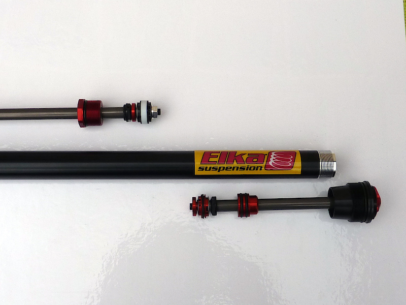 The Stage 4 cartridge is a sealed, but serviceable, unit that completely separates damping oil from the fork's lubrication oil, thereby increasing reliability and maintenance intervals. The internal floating piston is backed with a factory set nitrogen charge at 40 psi to keep the oil from foaming under hard use while compensating for the extra volume of the damping rod entering the cartridge. Elka recommends dropping the spring rate of your fork if you are going to use the Stage 4 due to the IFP pressure. The high flow piston uses shims to control high speed compression and rebound and as you'll hear Pat tell you in the audio below, there are basically limitless combinations that can be used to finetune to the stroke to your liking. Elka does a lot of suspension for motorized vehicles and they employ the same level of seals in the Stage 4 cartridge to keep the oil in and the nasty out. Internals are hard anodized as you would expect to see on a product such as this.