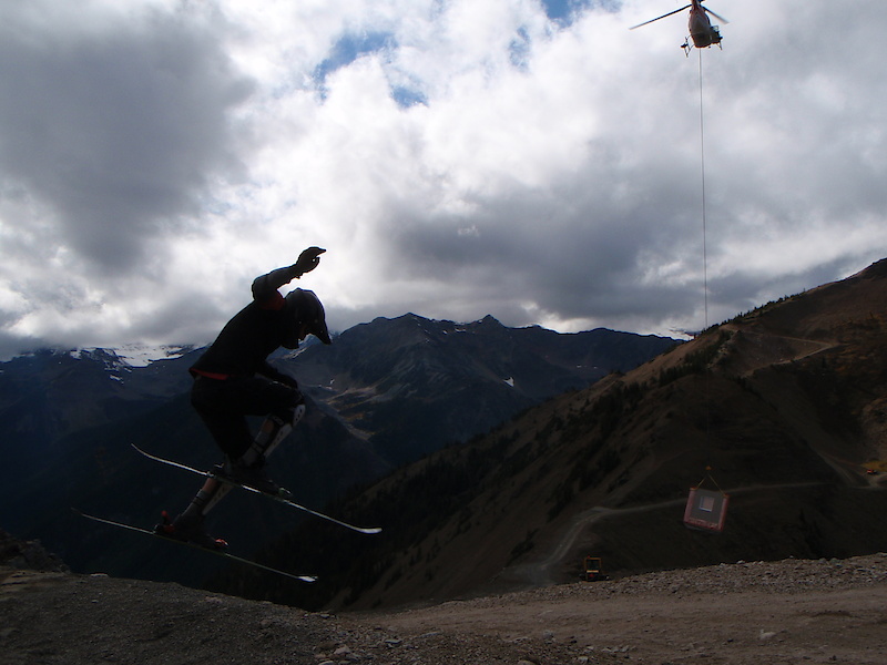 Aaron Enns collecting a summer pay cheque while training for winter. The helicopter is lifting part of the new patrol shack that now sits on the Super Bowl saddle - a brand new chunk of terrain open this winter.