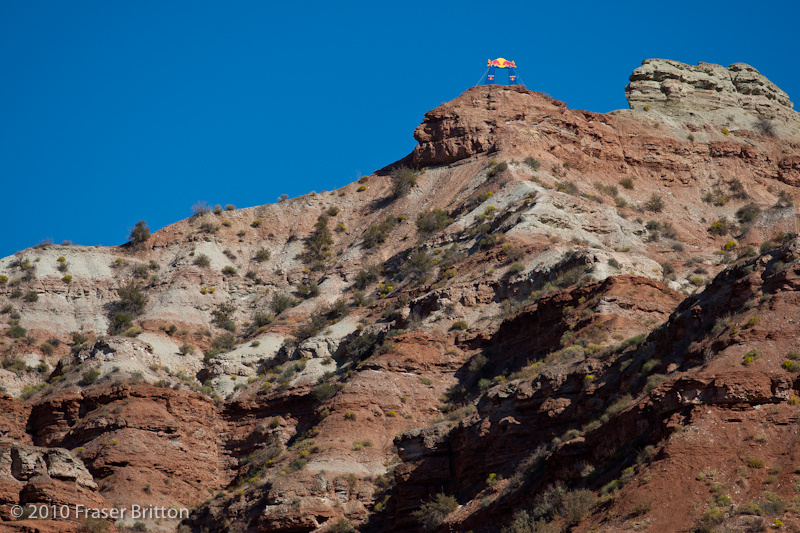 Some of the Quali Zone. The Red Bull Rampage takes place just outside of Virgin, Utah. This year the zone is the same one as 2 years ago, where qualifiers are held in one part of the bowl, and finals in the other. The riders who aren't pre-qualified have been out digging hard to get their lines dialed, while many of the pre-qualifiers are taking their time. Canada's Mike Hopkins is pre-qualified, but has been digging since Sunday to get his lines dialed for finals. Have a listen to the audio below to learn more about the contest layout and hear him describe the different zones.
