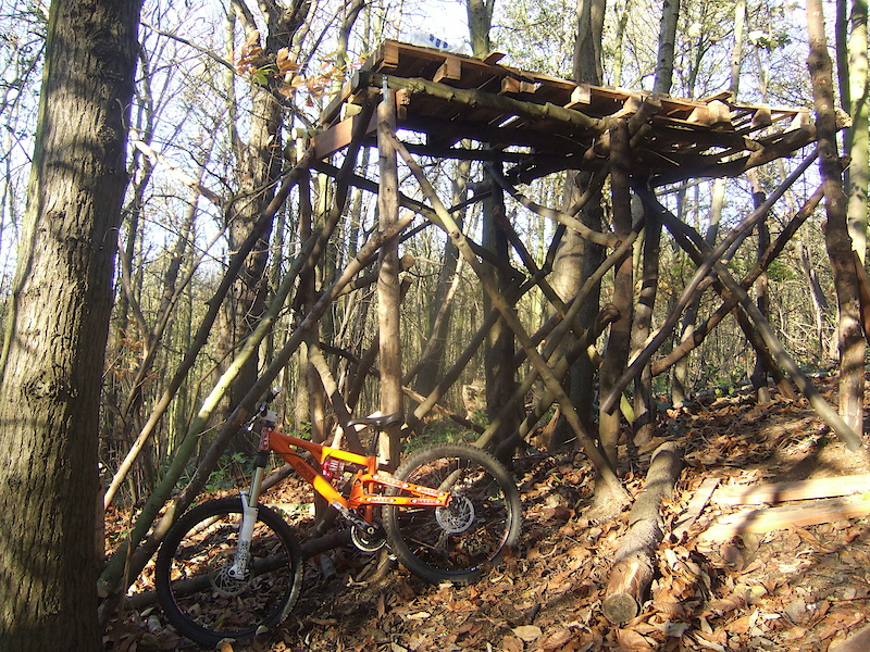 A side on view of the drop, bathed in sunlight, with Ben's slope bike in there for scale. We haven't got the tape measure on it yet. Any guesses?