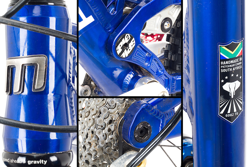 While there is plenty of whizzy suspension stuff to talk about, there is more to the Kalula than its rear end, including the burly tapered headtube up front that will come in handy if you choose to spec a long travel single crown fork like the Kashima equipped Van 180 FIT RC2 Fox 36 used on our test bike. The hydroformed top tube slopes aggressively down towards a short interrupted seat tube - there isn't a ton of room to adjust saddle height, but the majority of riders who are considering the Kalula won't be worrying about that fact. While it isn't a full-on downhill race bike, the Kalula does sport an 83 mm bottom bracket shell, ISCG05 chain guide tabs, and 12 x 150 mm axle spacing, meaning it accepts full sized downhilll parts. The rear brake caliper attaches via a 160 mm post mount. Cables are routed cleanly down the top of the down tube, and the frame comes with some protective tubing for the derailleur housing as it makes its way down the swingarm.