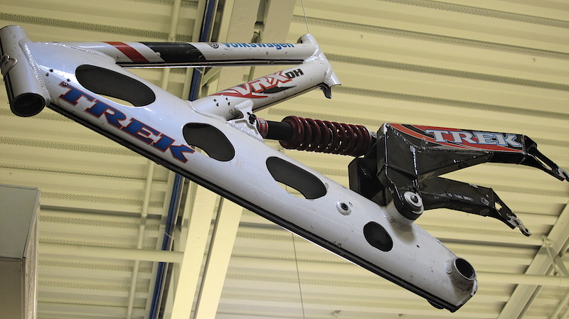 <span style='font-size:18px'>Sharples' swiss cheese VRX DH frame</span><br><br>The way things were. This VRX prototype was used by RaceBrain front man, and our own Sharp As A Marble columnist, Scott Sharples. The frame uses a simple single pivot swingarm with an early incarnation of a RockShox coil shock. This particular retired dinosaur no doubt enjoyed an interesting life, but one has to wonder if the 
