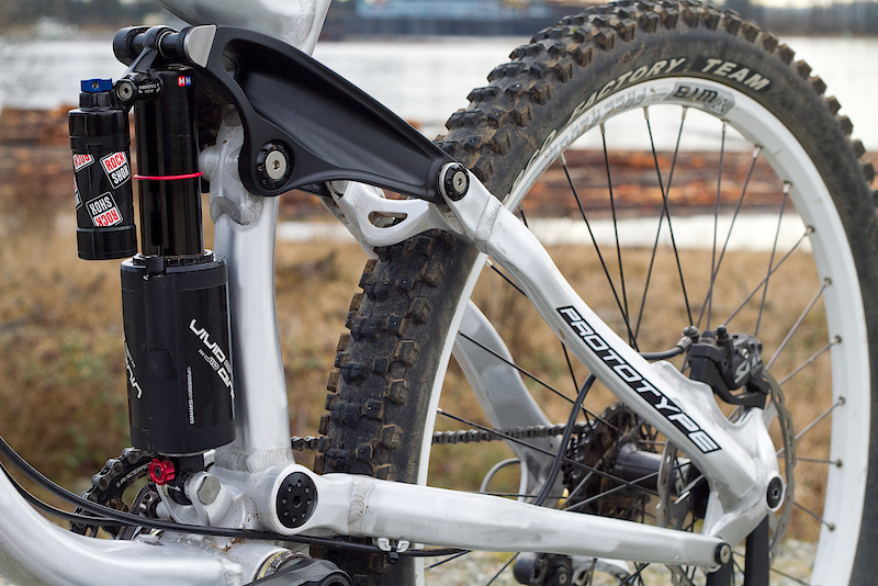 A closer look makes it very clear that the shock isn't floating, but mounted solidly to the main triangle. Yes, from a distance it may resemble other rigs... No, it is not the same and it will have a ride personality all to its own. There are only so many ways to layout a bike, and as designs progress it will be the smallest of margins that will make one stand out from another. Two bikes may share a similar silhouette, but a chain stay being slightly longer on one or a pivot point that differs by just a few millimeters, let alone the angles, will result in massive differences on the trail.
