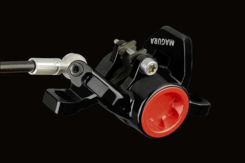 Magura's one-piece aluminum double-arch caliper provides stiffness, and allows for top-loading brake pads.
