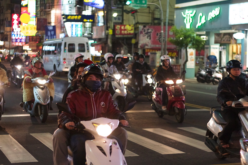 Scooter gang! I think that this particular group is known in local circles as the 'Asphalt Dragons'. Seriously though, there is an improbable amount of scooters buzzing about, many times more than cars that are on the roads. They make short work of the traffic in the city, shooting through impossible gaps in traffic and generally making the cars look foolish. It's not uncommon to see three people, a dog and a bag of groceries piled onto a single scooter.