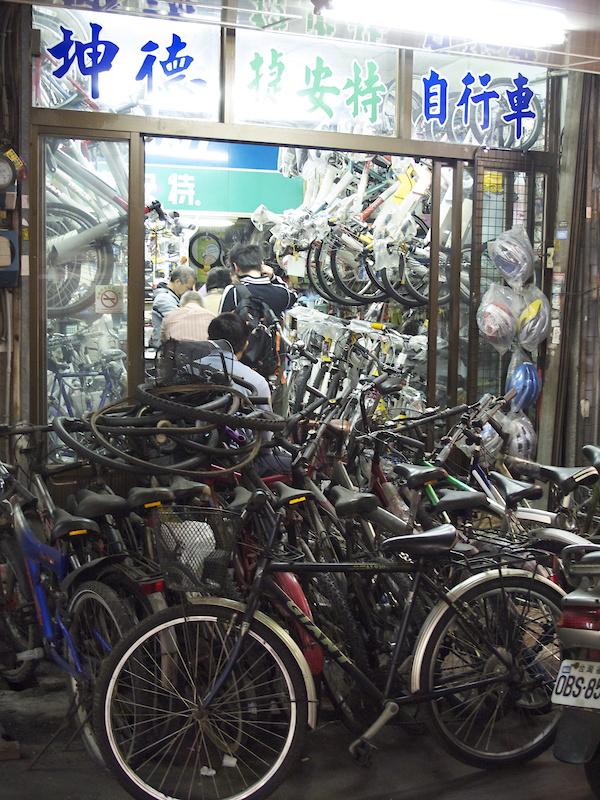 Crammed into this tiny unit was a local bike shop, complete with sales floor and repair area... sort of. While there is a small but dedicated mountain bike scene in Taiwan, bikes are mostly used as transportation to get from one place to another.