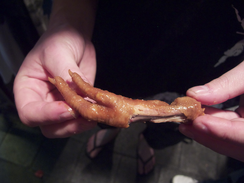 Mike downing some chicken foot just prior to sampling some blood rice - rice that has been soaked in pig's blood and served on a stick. While it didn't taste quite as bad as expected, he won't be having another pig-sicle anytime soon...