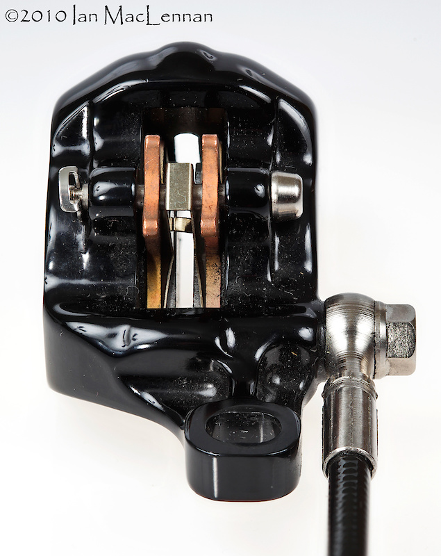 The One calipers use easy-to-replace, top-loading brake pads. The sintered metallic pads, shown here, stop the hardest and wear the longest. Pinkbike tried the organic pads and went through them regularly in wet and sloppy race conditions.