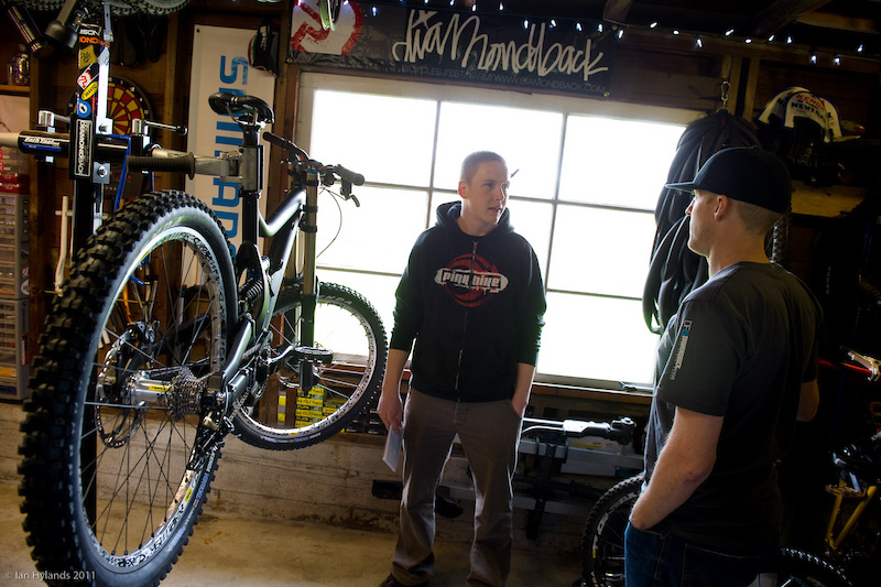 Jon Kennedy (<i>right</i>) explains the ins and outs of what they are aiming for with the new bike. Depending on how testing of future prototypes goes, it could look quite different than what you see here by the time it reaches production. While they could have gone the easy route and adapted their proven Knucklebox suspension to a longer travel DH platform, it proved to be better suited to their All-Mountain and Cross-Country bikes - despite the fact that it would have been easier and faster than designing a new linkage layout. Diamondback is committed to making the new bike a winner right out of the box.