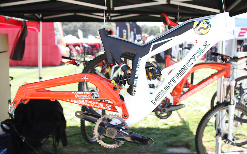 Mountain Cycle's prototype 8 inch travel Shockwave Two continues with the company's single pivot design, but they have now incorporated a novel eccentric linkage to actuate the shock that rotates on a bearing within the swingarm.<br><br><span style='font-size:19px'>Mountain Cycle Shockwave Two details:</span><br><br>- 2012 prototype <br>- 8 inches of rear wheel travel<br>- Unique Turntable eccentric linkage system<br>- Monoqouce top tube<br>- 1.5 inch head tube (<i>comes with Cane Creek AngleSet</i>)<br>- ISCG 05 chain guide tabs<br>- Massive M35 bottom bracket