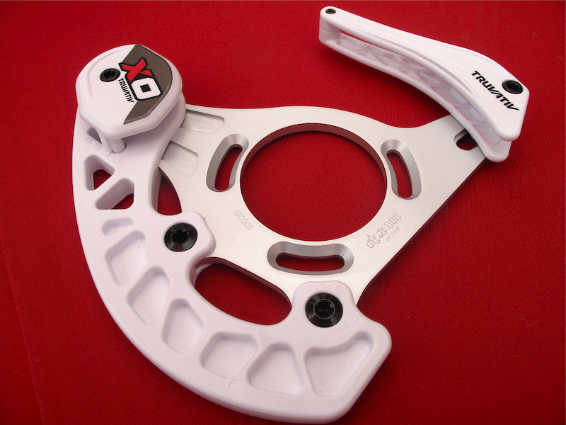 The replaceable skid guard is attached to the back plate at three points.
