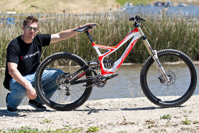Curtis and his Demo 8 - what makes his bike so much more special than yours? The prototype 135 x 12mm rear end for starters. On that 135mm rear end you'll find a 9-20 tooth spread 7 speed cassette<br><br><span style='font-size:19px'>The details on Keene's Demo:</span<br><br>- 135 x 12mm rear hub spacing<br>- 7 speed cassette<br>- 9-20 T gearing spread<br>- wider width between flanges than current 150mm results in a zero dish rear wheel<br>- Slimmer rear triangle over current 150mm rear end<br>- RockShox Keronite WC BoXXer<br>- Prototype Specialized Butcher DH tires<br>- Prototype Specialized rim<br>- AngleSet at negative 1 degree (63 degree HA)<br>- Weight: 36.1lbs