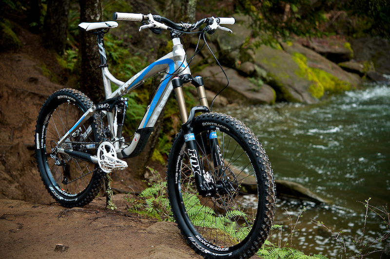 The 2011 Trek Scratch Air is quite the versatile steed to consider if you are a full-mountain assaulter who can only own, or only wants to maintain, one bike.<br><br><span style='font-size:17px'>Trek Scratch Air details:</span><br><br>- Designed to be a middle ground between an all-mountain bike and a gravity bike<br>- 170mm (6.7 inches) of rear wheel travel<br>- 160mm (6.3 inches) or fork travel<br>- Fox 36 Float R fork and Fox Float RP-2 shock<br>- Adjustable geometry (66/66.6 degree head angle)<br>- Uses Trek's ABP and Full Floater suspension<br>- MSRP $3879.99 USD