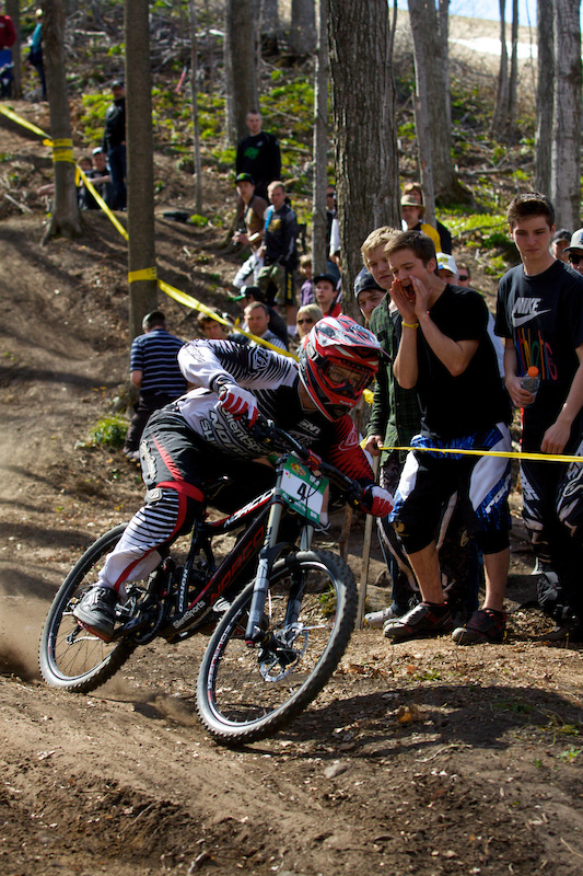  34. Mike Hermanovsky on the bike with Jamie Tice in the background screaming his lungs off.