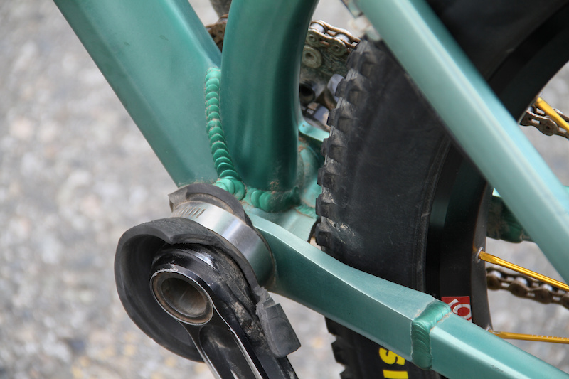 A clever arrangement of machined pieces and tubing allows the rear wheel to be tucked in extremely close to the bottom bracket shell.