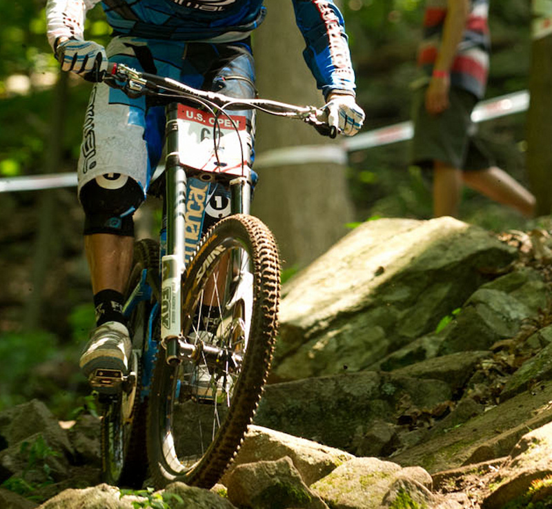 While much is still unknown about the prototype fork, looking at this photo does tell us a few details. It seems to use a standard sized 20mm thru-axle, as well as Kashima coated tubes to help it slide smoothly. An adjuster, one that looks nothing like what is used on standard 40's, can clearly be seen at the bottom of the drive side fork leg, and the upper tubes seem to have an external taper to them, increasing in size as they reach the fork clamps.