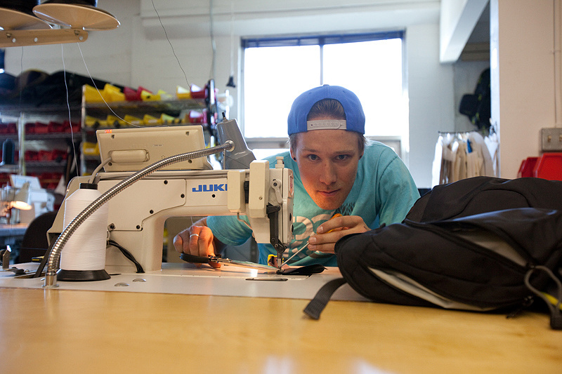 Geoff learning how to stitch up a new pack design at DAKINE.