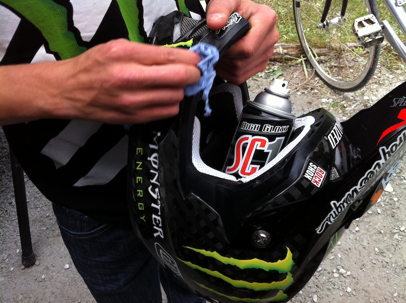 Troy Brosnan takes the mechanics secret to his helmet post quali run.  