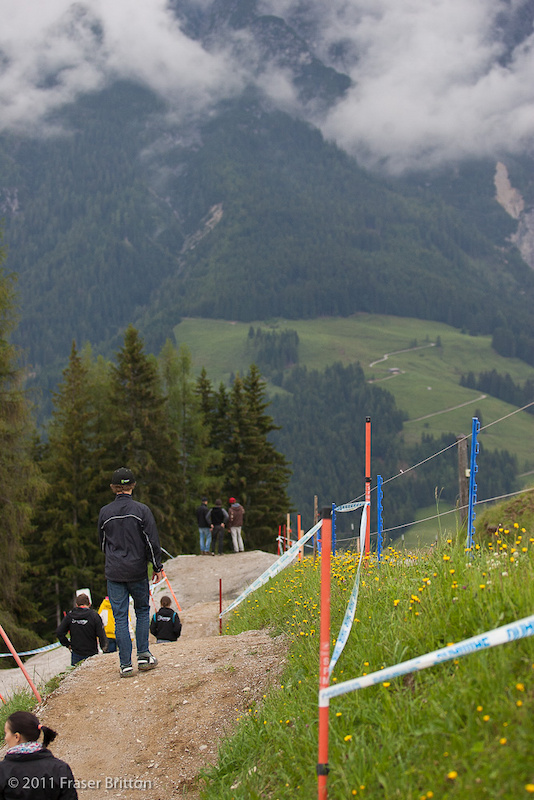 Leogang Austria - World Cup. Troy Brosnan checks out the jumps on the first pedal section.